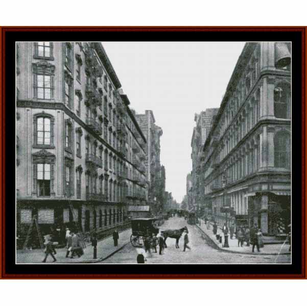 Counted Cross Stitch Pattern: New York Street Scene, 1910 - Cross Stitch Collectibles - A framed black and white historical photograph print depicting a bustling city street with pedestrians, horse-drawn carriages, and tall urban buildings