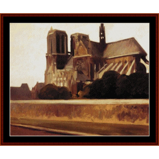 Counted Cross Stitch Pattern: Notre Dame by Edward Hopper- Cross Stitch Collectibles - A framed art print depicting a warm-toned painting of a historic cathedral with dark trees in the foreground