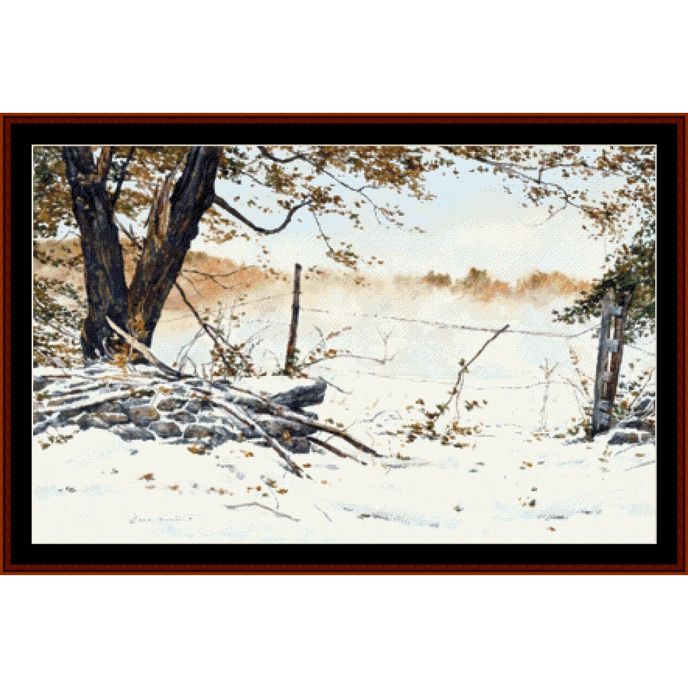 Counted Cross Stitch Pattern: October Paradox, Americana - Cross Stitch Collectibles - A framed winter landscape painting showing snow-covered ground, bare trees, a rustic stone wall, and a misty field in the background