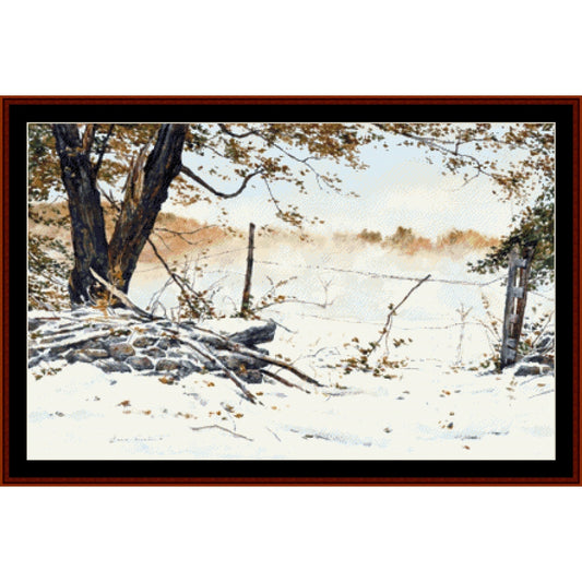 Counted Cross Stitch Pattern: October Paradox, Americana - Cross Stitch Collectibles - A framed winter landscape painting showing snow-covered ground, bare trees, a rustic stone wall, and a misty field in the background