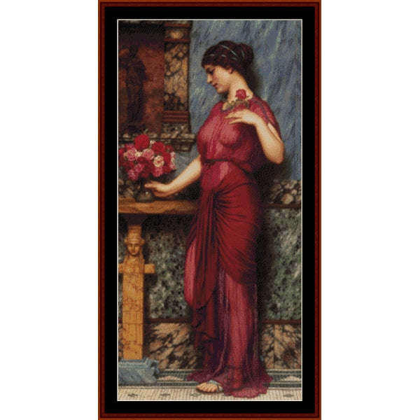 Counted Cross Stitch Pattern: Offering to Venus by J.W. Godward - Cross Stitch Collectibles - A framed art print featuring a classical painting of a woman in a flowing red dress standing beside a table with flowers