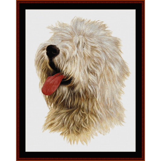 Counted Cross Stitch Pattern: Old English Sheepdog - Cross Stitch Collectibles - A framed portrait artwork of a fluffy white and cream dog with its tongue out, shown against a white background 