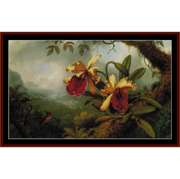 Counted Cross Stitch Pattern: Orchids and Hummingbird by M.J. Heade - Cross Stitch Collectibles - A framed botanical art print depicting two large yellow and red orchids among green leaves, set against a misty forest landscape. 