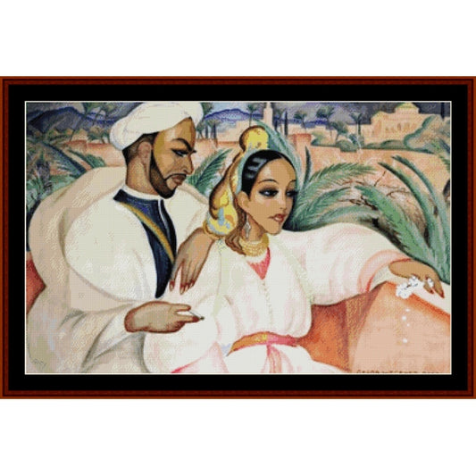 Counted Cross Stitch Pattern: Oriental Couple by Gerda Wegener - Cross Stitch Collectibles - A framed art print depicting an Arabic couple in traditional white robes, with a man on the left and a woman on the right, set against a landscape background with green palm leaves and beige buildings.