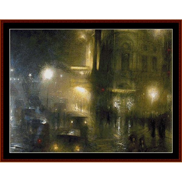 Counted Cross Stitch Pattern: Picadilly Circus at Night by Arthur Hacker - Cross Stitch Collectibles - A framed impressionist-style painting depicting a rainy city street at night with glowing streetlights, blurred figures, and a dark building facade.