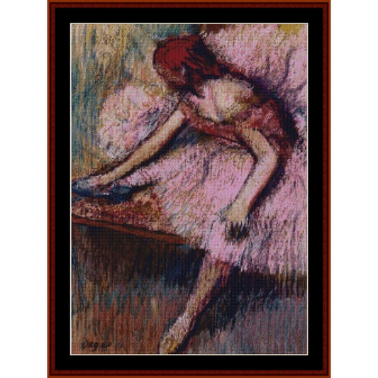 Counted Cross Stitch Pattern: Pink Dancer II by Edgar Degas - Cross Stitch Collectibles - A framed art print featuring an impressionistic painting of a woman in a pink dress leaning over a table