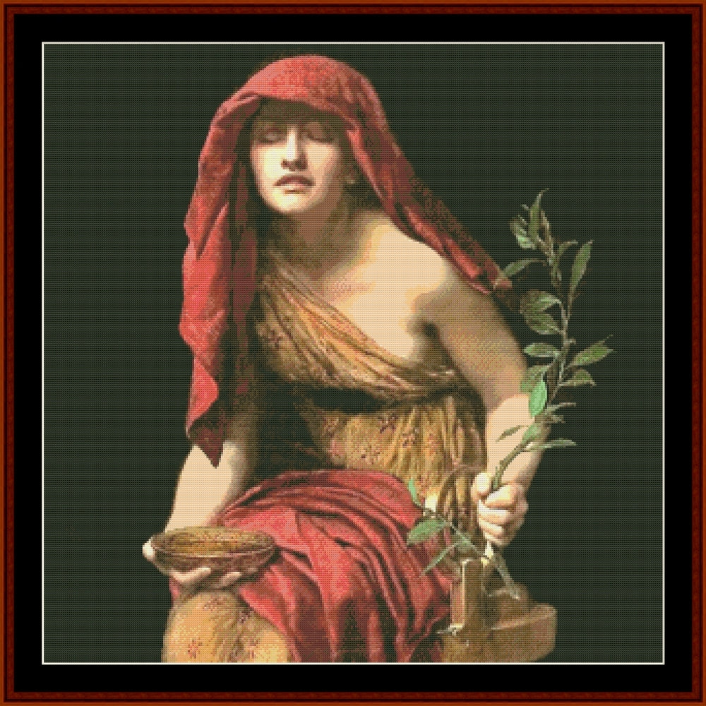 Counted Cross Stitch Pattern: Priestess of Delphi by John Collier - Cross Stitch Collectibles - A framed classical-style artwork showing a seated woman draped in red fabric, holding a green leafy branch and a small bowl, against a dark background.