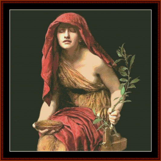 Counted Cross Stitch Pattern: Priestess of Delphi by John Collier - Cross Stitch Collectibles - A framed classical-style artwork showing a seated woman draped in red fabric, holding a green leafy branch and a small bowl, against a dark background.