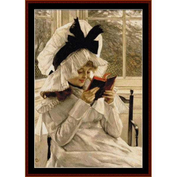 Counted Cross Stitch Pattern – Reading a Book by James T. Tissot - Cross Stitch Collectibles - A framed vintage-style painting or print showing a woman in a white dress and large white bonnet with black feathers, reading a red book near a window.