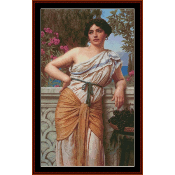 Counted Cross Stitch Pattern – Reverie, 1912 by J.W. Godward - Cross Stitch Collectibles - A framed classical painting depicting a woman in draped white and ochre garments leaning on a stone railing, with pink flowers and greenery in the background