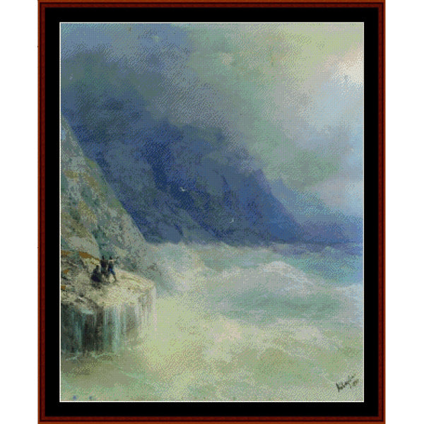 Counted Cross Stitch Pattern – Rocks in the Mist, 1890 by Ivan Aivazovsky - Cross Stitch Collectibles - Framed impressionist landscape painting depicting a dramatic coastal scene with a dark blue mountain or cliff, white surf, and misty greenish sky