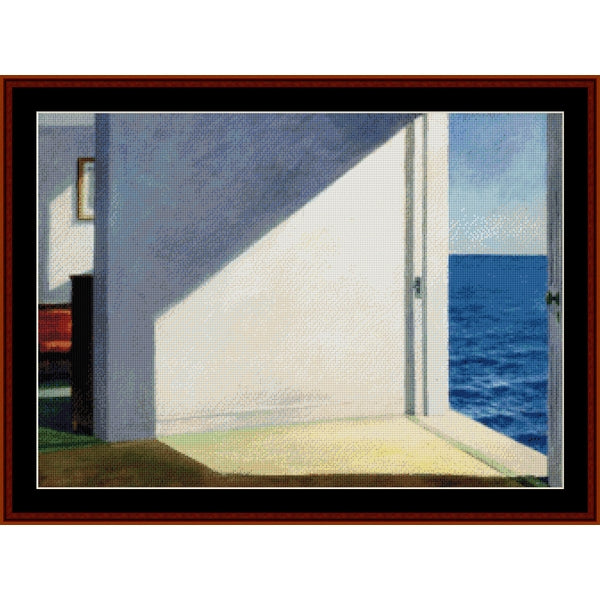 Counted Cross Stitch Pattern – Rooms by the Sea by Edward Hopper- Cross Stitch Collectibles - A framed art print depicting a minimalist interior scene with a white wall casting a shadow onto a light floor, with an open door revealing a blue ocean view under a pale sky.