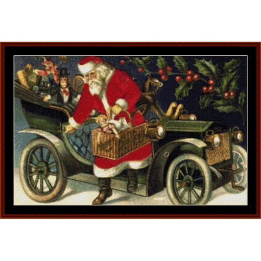 Counted Cross Stitch Pattern – Santa with Basket, Holiday - Cross Stitch Collectibles - A framed vintage Christmas illustration showing Santa Claus in a red suit loading a basket into an old-fashioned green car, with holiday holly and red berries in the background.