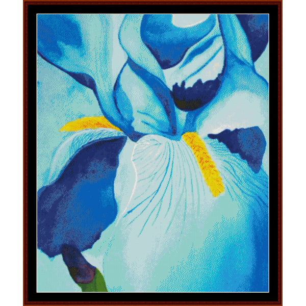 Cross Stitch Pattern by Cross Stitch Collectibles of a blue and white flower with yellow center on a light blue background